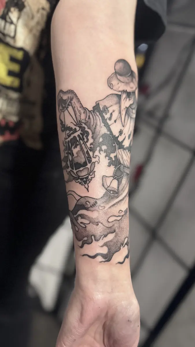 Blackwork forearm sleeve tattoo with flowing cloud and wave shapes