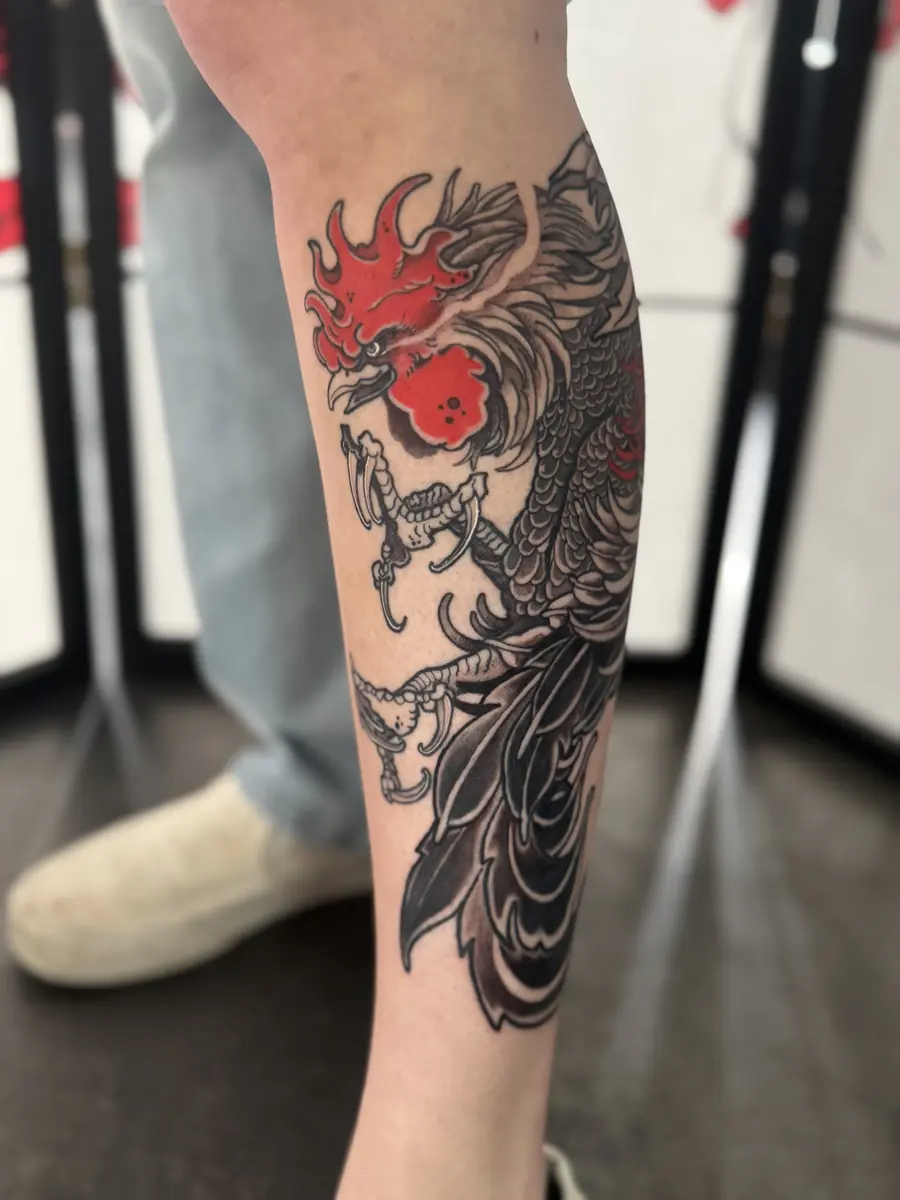 Blackwork leg sleeve tattoo with Japanese influence and a single red accent, tattooed at Blind Fox Tattoo in Amarillo, TX