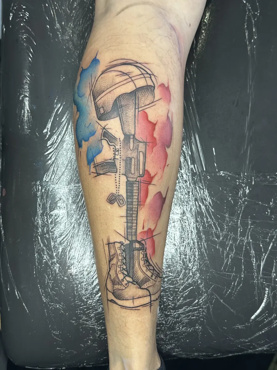 Watercolor style guitar tattoo on a calf with blue and red color wash behind it